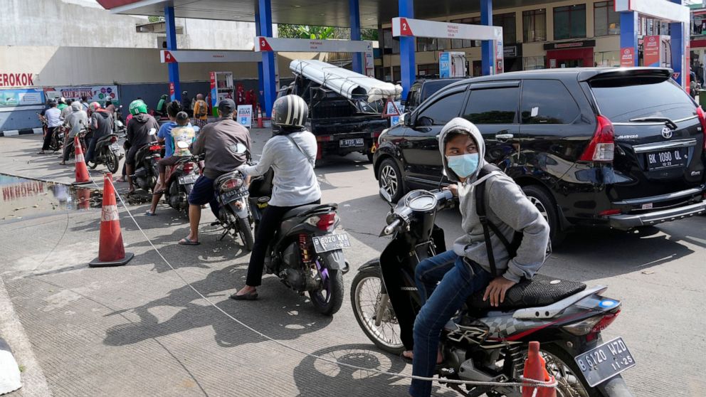 Motorists queue up to fill up their tanks after the government announced an increase in fuel prices, at a gasoline station in Jakarta, Indonesia, Saturday, Sept. 3, 2022. Fuel prices increased by about 30 percent across Indonesia on Saturday after th
